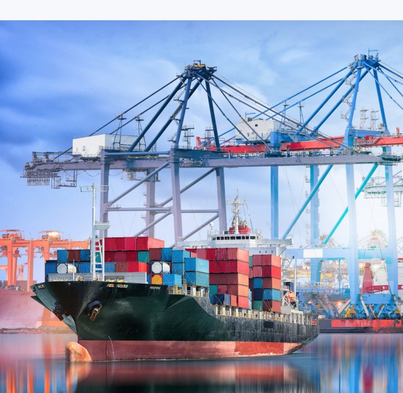 Container ship at port being unloaded by gantry cranes
